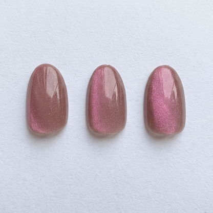 Rose-pink shimmer press-on nails with pearlescent shine, glossy finish, three swatches.