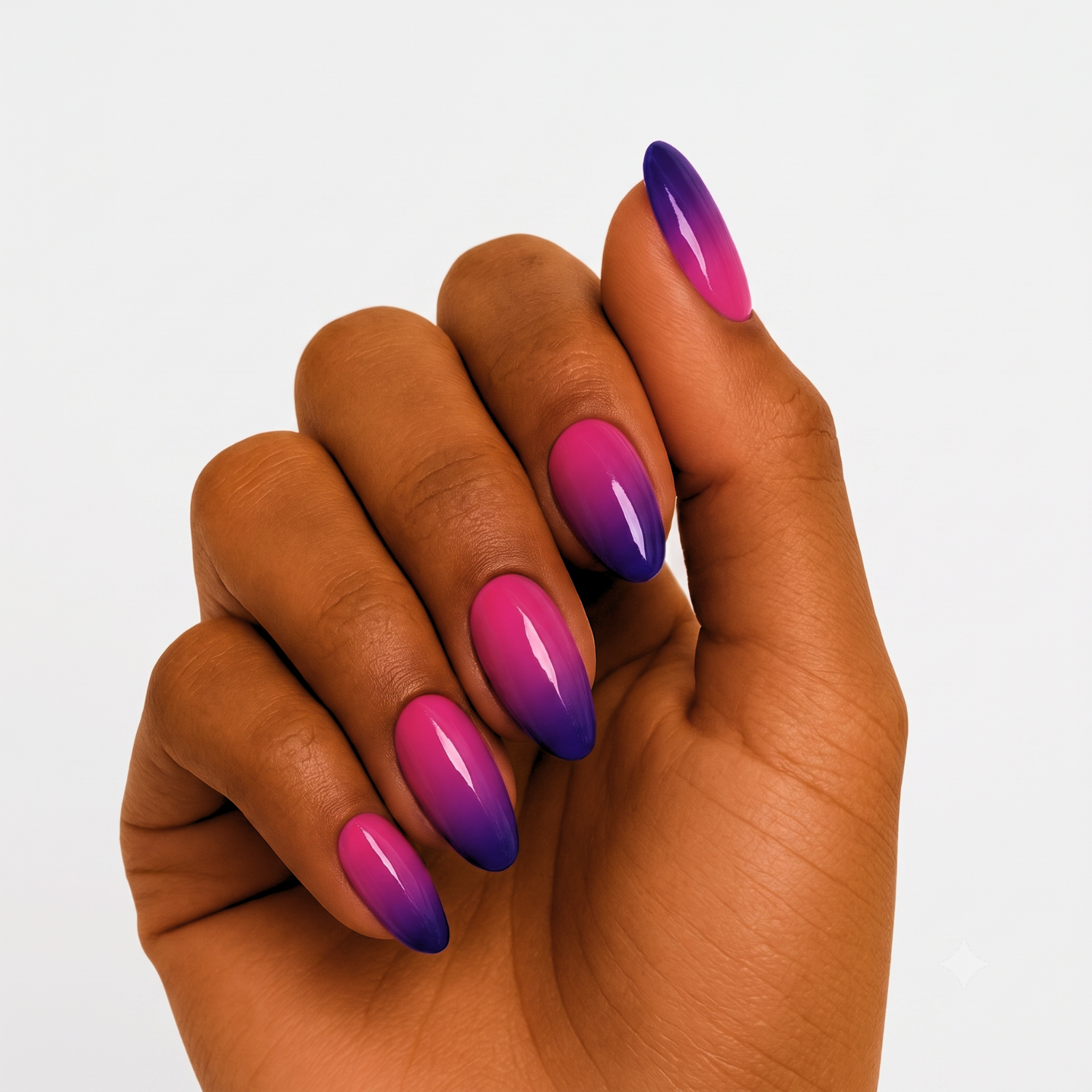 Glossy press-on nails with pink-to-purple ombré gradient, almond shape