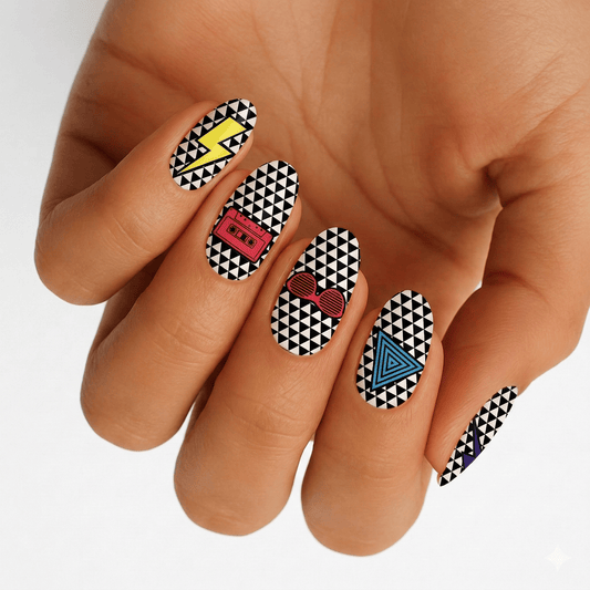 Hand displaying geometric black white nail wraps with colourful 80s retro triangle pattern design