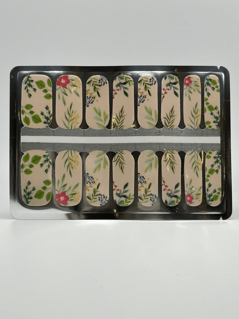 Sheet of botanical nail wraps with sage green leaf patterns on cream background