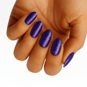 Purple shimmer nail wraps with metallic glitter finish on hand manicure