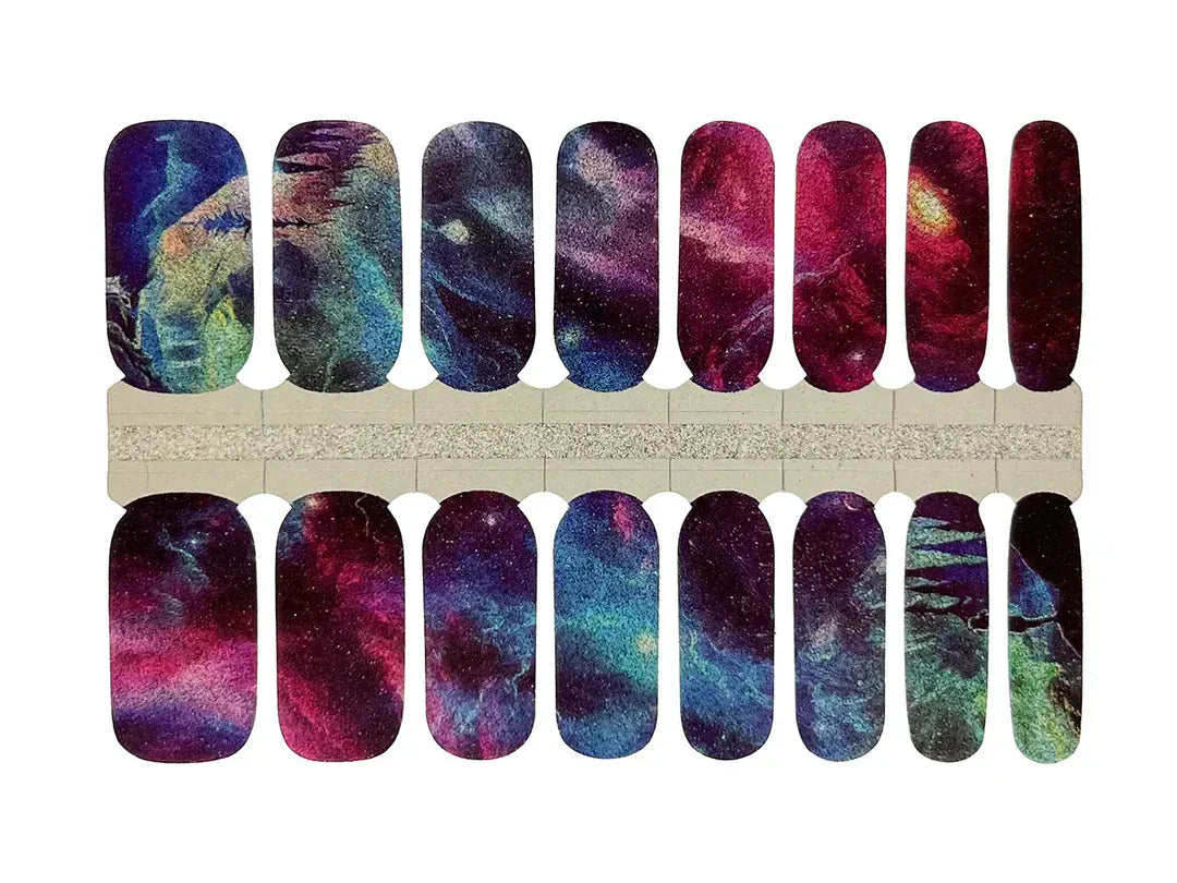 Northern lights nail wraps sheet displaying cosmic glittery blue purple pink aurora patterns