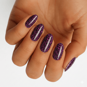 Purple leopard print nail wraps on hand showing metallic animal print manicure design