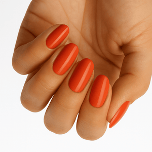 Hand showing burnt orange rust gel nail wraps for autumn at-home manicure