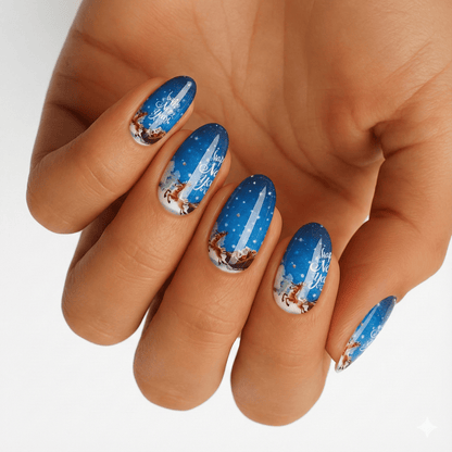 Blue Christmas nail wraps with Santa's sleigh and reindeer pattern on hand