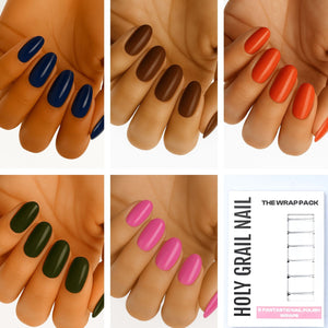 Multicoloured nail wraps on hands showing blue brown orange green pink solid colour designs