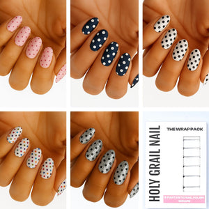 Polka dot gel nail wraps on hands in pink, navy, white and grey spotted patterns