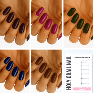 Dark vampy gel nail wraps collection showing purple burgundy green blue brown shades on hand