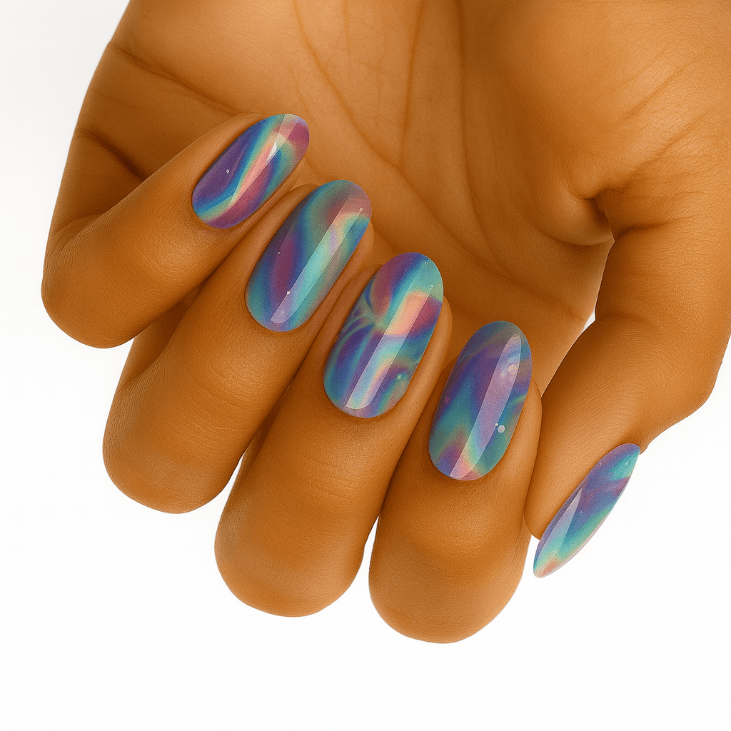 Holographic rainbow nail wraps on hand displaying chrome multicolour prismatic finish for festival looks