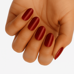 Hand displaying glossy red wide fit nail wraps in classic vermillion shade