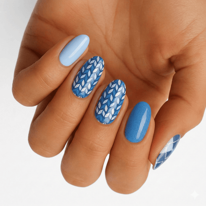 Blue wave pattern nail wraps on hand featuring geometric chevron design for DIY manicure