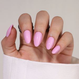 Pink orchid soft gel press on nails short almond shape on hand
