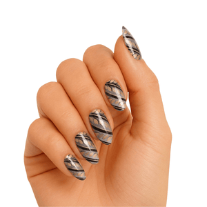 Black and white marble gel nail wraps with elegant swirl patterns on hand