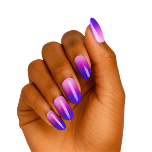 Purple to pink ombre gel nail wraps on hand showing glossy gradient manicure