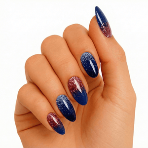 Navy blue gel nails on hand with rose gold glitter gradient almond shape