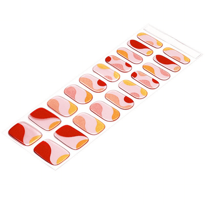 Semi-cured gel nail wrap strips in multicoloured abstract pink coral gold patterns