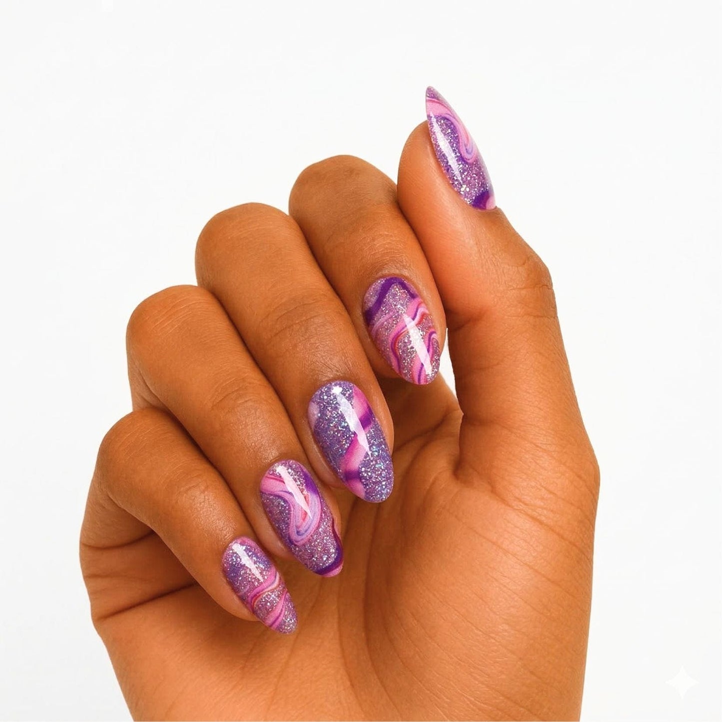 Purple and pink marble gel nail wraps with swirl pattern on woman's hand