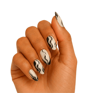 Black and white smoke pattern gel nail wraps on hand