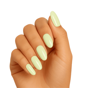 Hand wearing mint green gel nail wraps for professional at-home manicure
