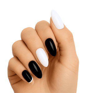 Black and white gel nail wraps on hand showing glossy monochrome manicure