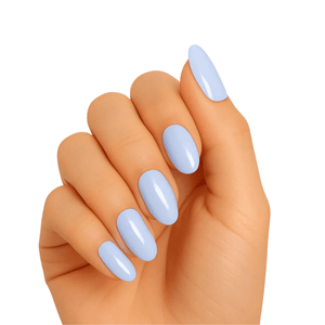 Hand wearing powder blue gel nail wraps in glossy sea foam shade for at-home manicure