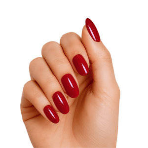 Deep red glossy gel nail wraps on hand showing crimson manicure finish