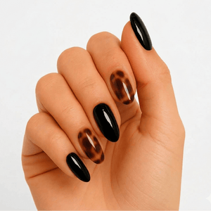 Black and brown tortoiseshell gel nails with glossy finish on hand